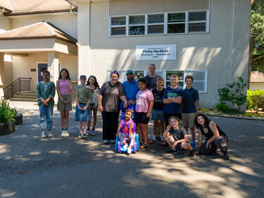 Mr. Amendt and his students gift 5-year-old Prescott with a 3D-printed mobility device.