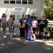 Mr. Amendt and his students with Prescott and her family