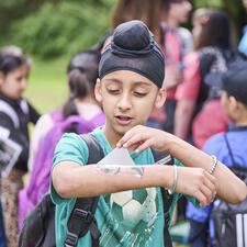elementary student with temp tattoo